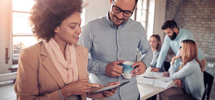 woman and man viewing tablet