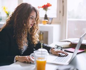 woman researching mba or masters degree programs