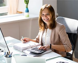 accountant with associate degree doing entry level work at desk